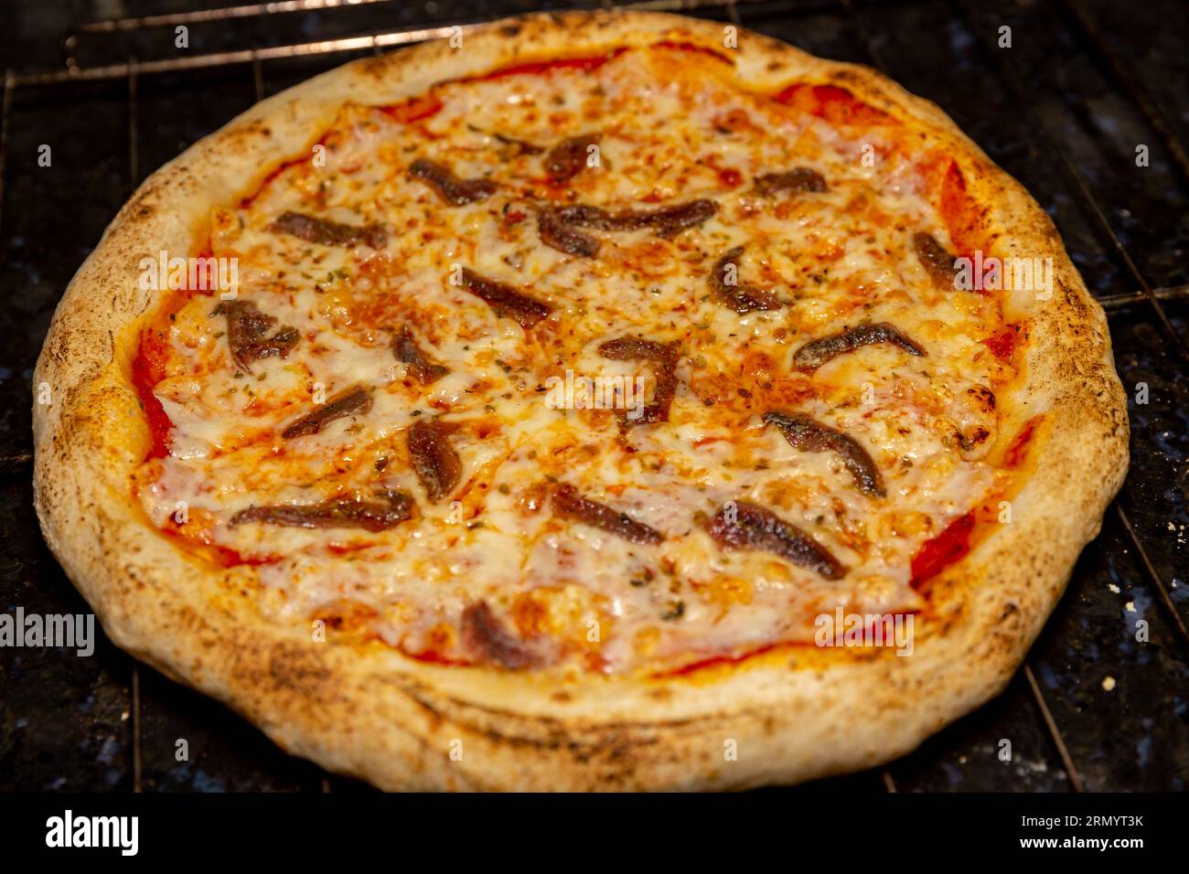 Traditional anchovy pizza (alicci) with artisan longmatured dough. "vera pizza" Neapolitan