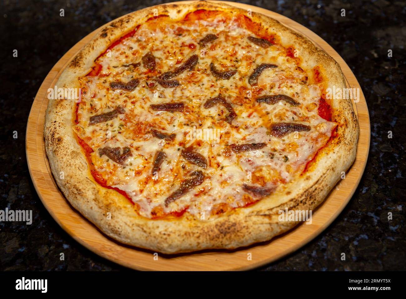 Traditional anchovy pizza (alicci) with artisan longmatured dough. "vera pizza" Neapolitan