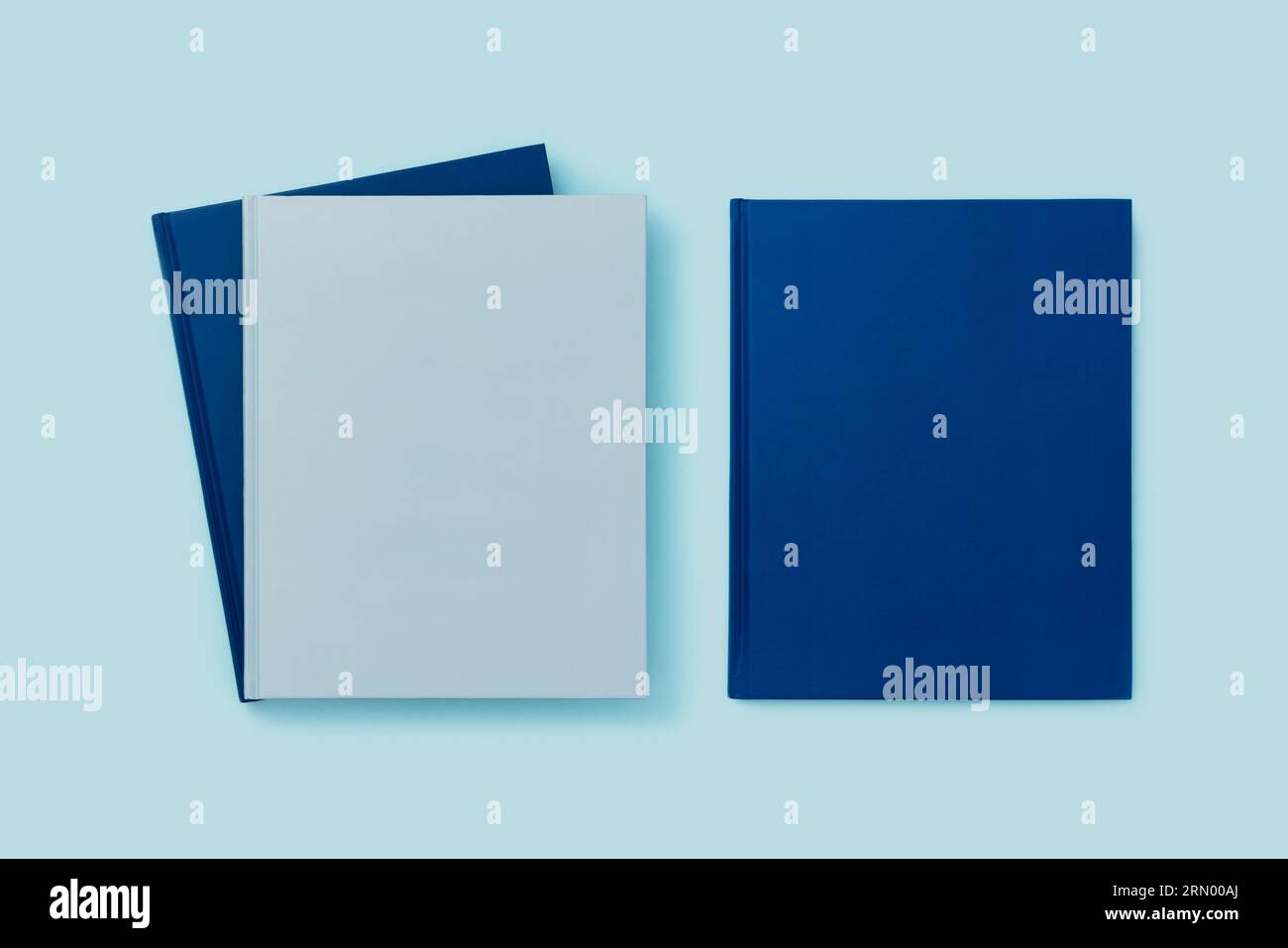 Back to school flat lays on blue background. Blue books on blue