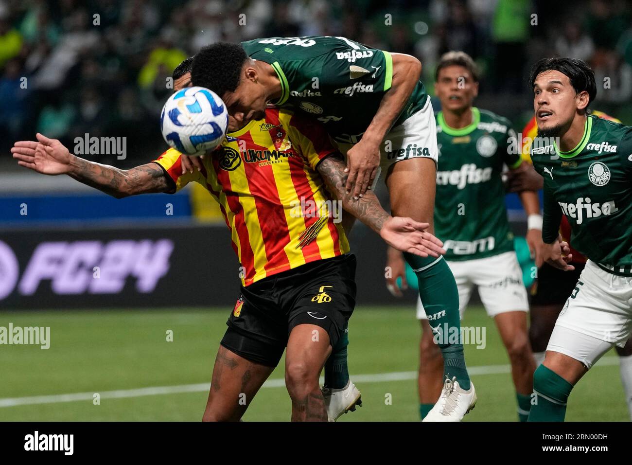 Adrian Balboa of Colombia's Deportivo Pereira, left, heads the ball with  Murilo of Brazil's Palmeiras during a Copa Libertadores quarterfinal second  leg soccer match at Allianz Parque stadium in Sao Paulo, Brazil