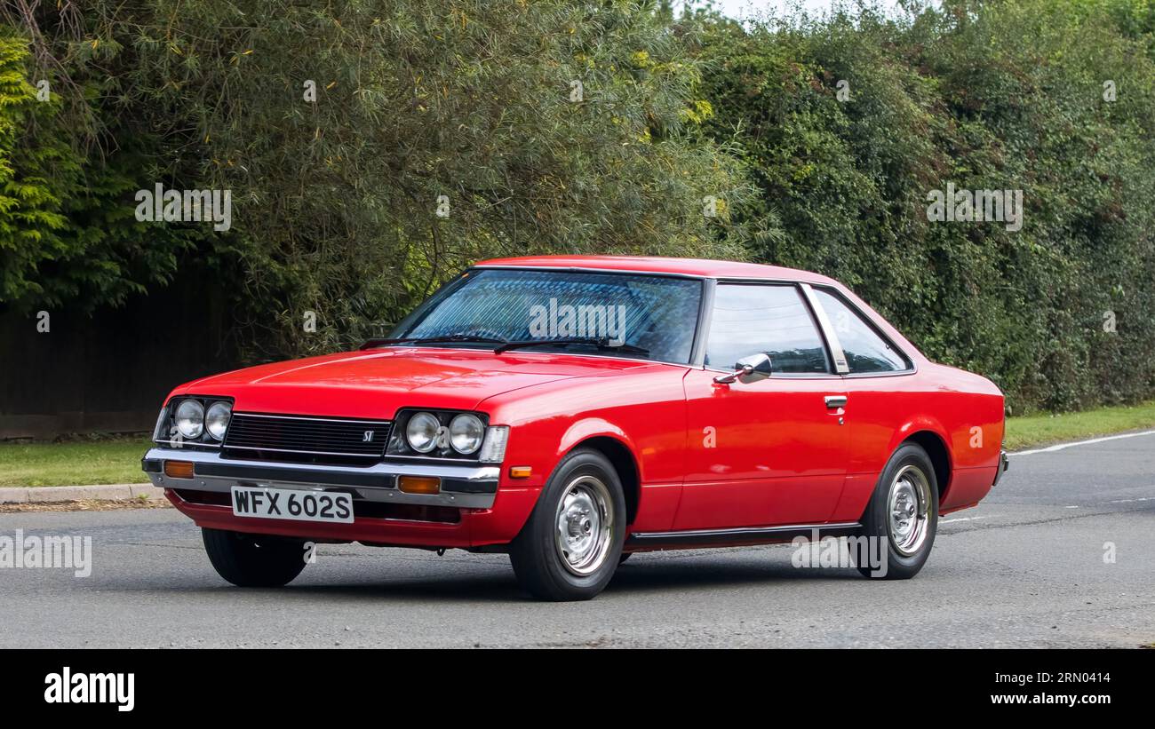 Whittlebury,Northants,UK -Aug 27th 2023:  1978 red Toyota Celica  car travelling on an English country road Stock Photo