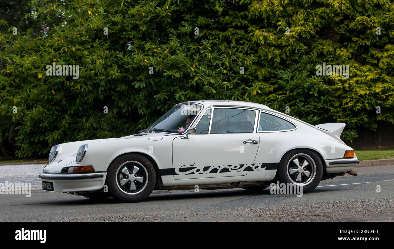 Whittlebury,Northants,UK -Aug 27th 2023: 1972 white PORSCHE 911 Carrera  car travelling on an English country road Stock Photo
