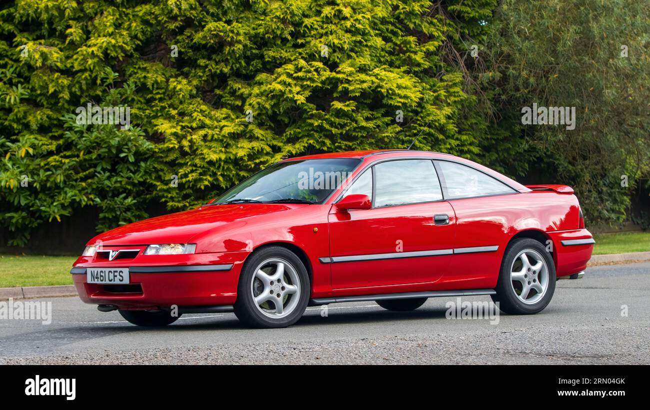 Whittlebury,Northants,UK -Aug 27th 2023: 1995 red Vauxhall Calibra car travelling on an English country road Stock Photo