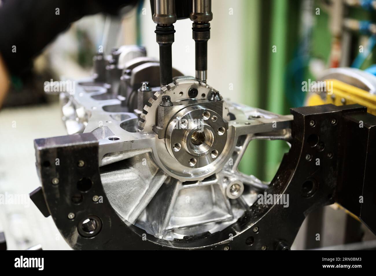 Cylinder block complete with crankshaft. Assembly line of internal