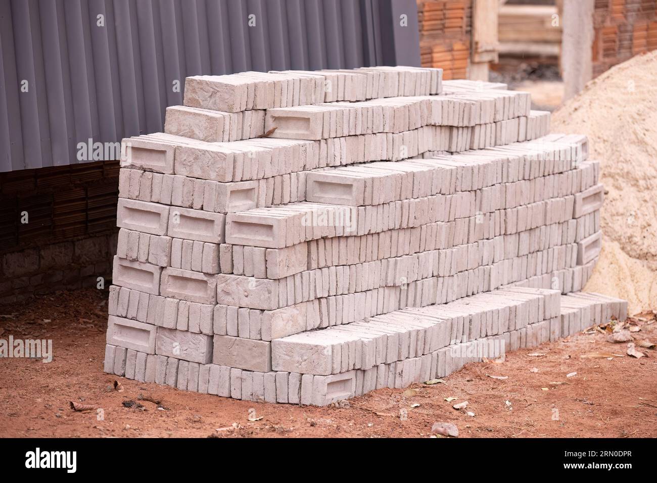 closeup of stack of small concrete bricks for building construction Stock Photo