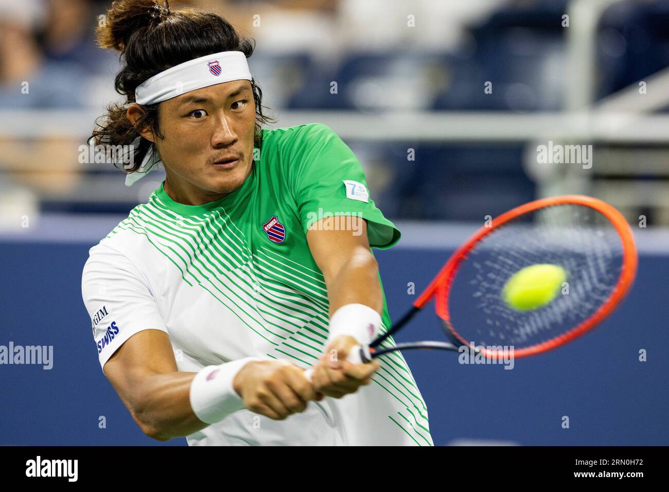 New York, USA. 30th Aug, 2023. Zhang Zhizhen of China hits a return during  the men's singles second round match against Casper Ruud of Norway at the  2023 US Open tennis championships