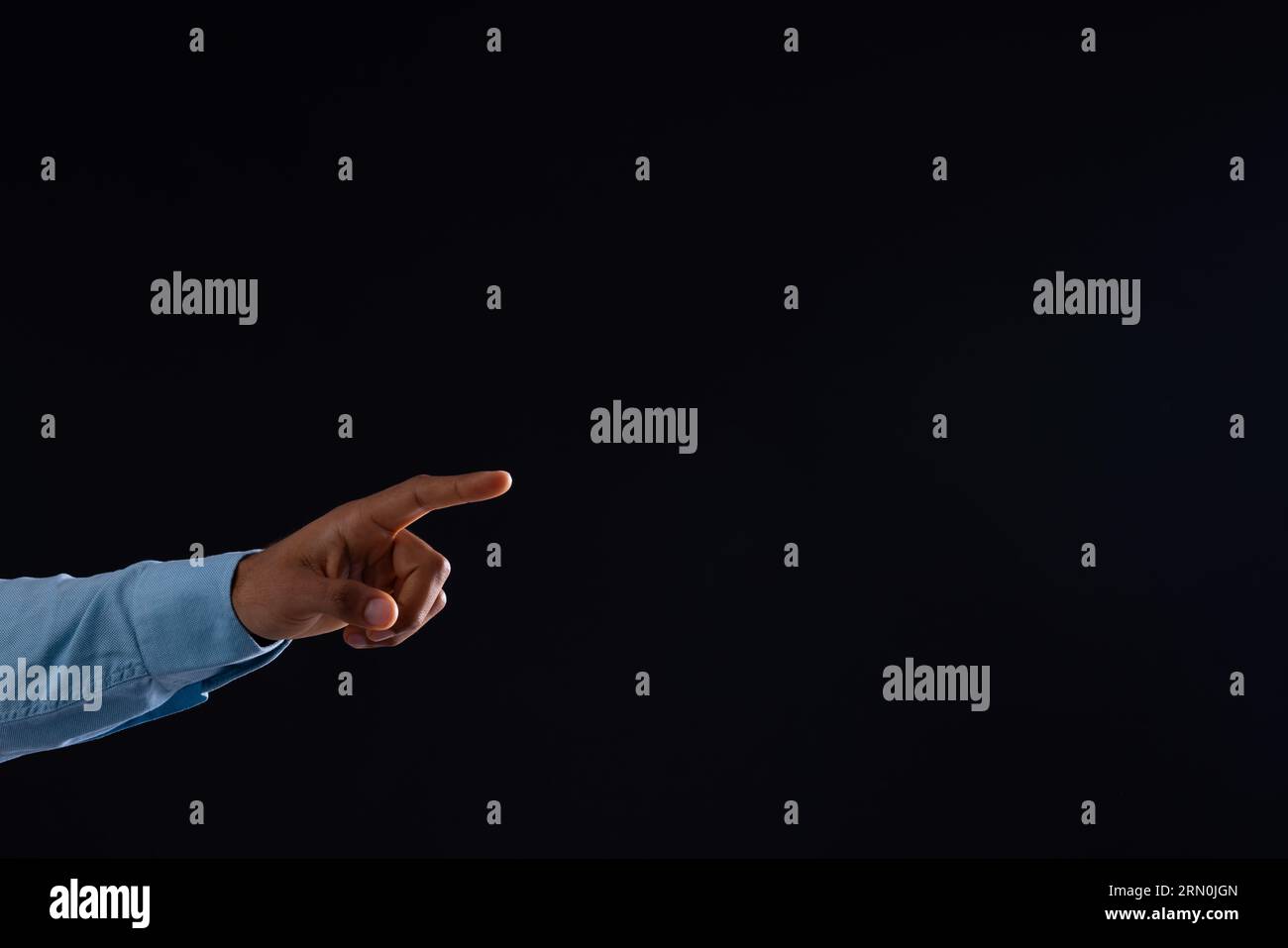 Black hand pointing hi-res stock photography and images - Alamy