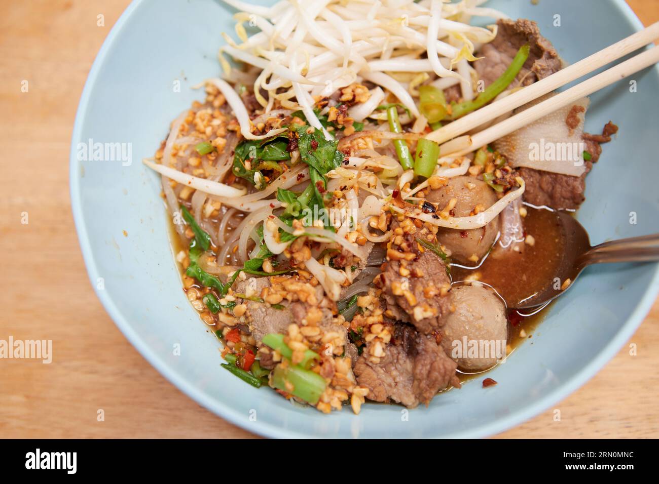 Rice stick noodles with braised beef and meatball in a bowl Stock Photo