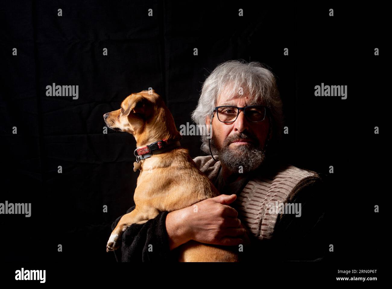 Older man with his dog Stock Photo