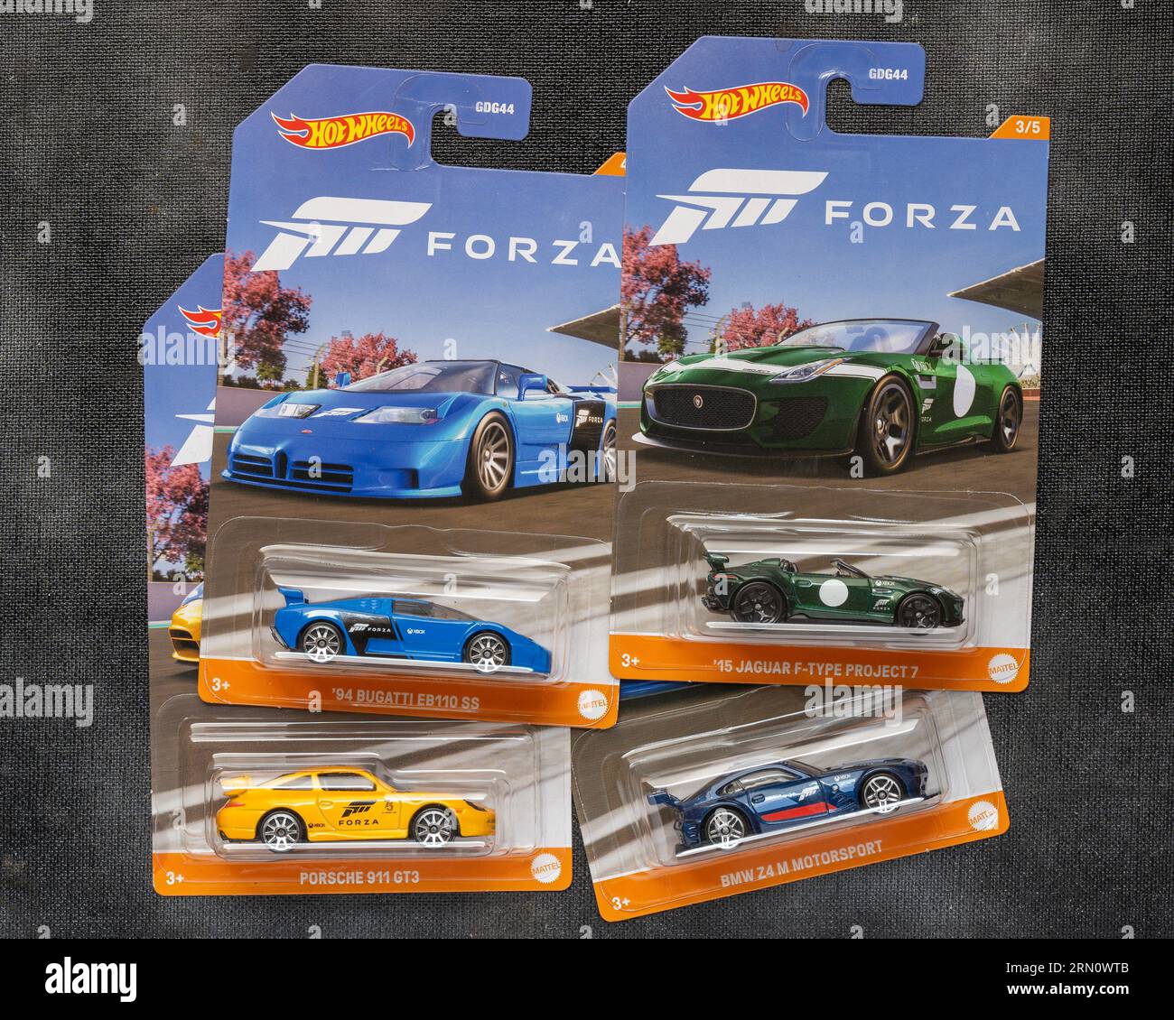 Doha, Qatar - August 17, 2023: Assortment of Hot Wheels die cast carded car model for Hot Wheels series. Hot Wheels is a scale die-cast toy cars by Am Stock Photo