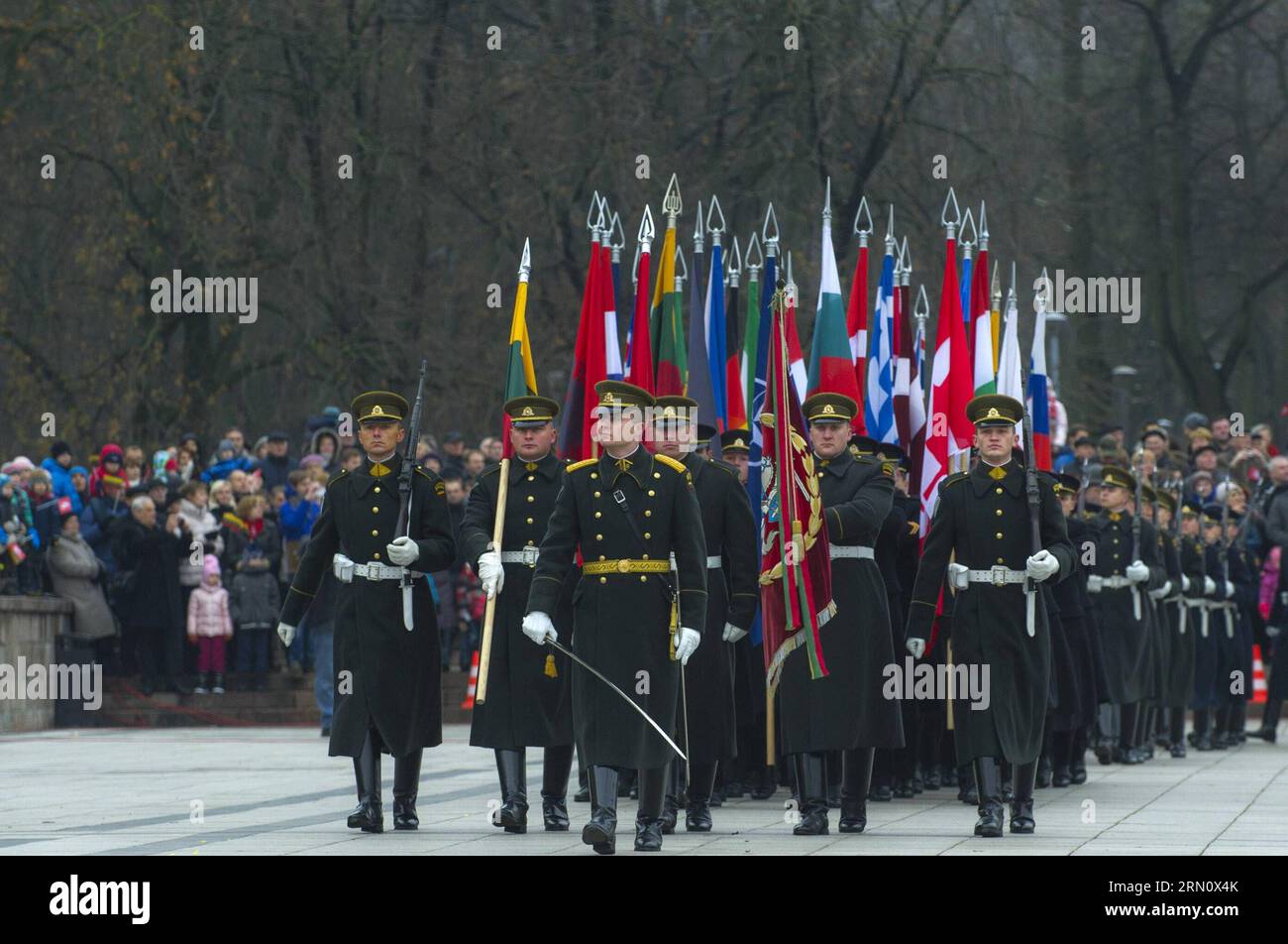 (141123) -- VILNIUS, Nov. 23, 2014 -- Guard of honor carry the flags of NATO member countries on the celebration in Vilnius, Lithuania, on Nov. 23, 2014. Lithuanian armed forces and troops of some NATO member countries held a gala with formation on Sunday to celebrate the Armed Forces Day. Lithuania s first decree on establishing armed forces was approved on Nov. 23, 1918, which became the Armed Forces Day of the Baltic country. )(bxq) LITHUANIA-VILNIUS-ARMED FORCES DAY AlfredasxPliadis PUBLICATIONxNOTxINxCHN   Vilnius Nov 23 2014 Guard of HONOR Carry The Flags of NATO member Countries ON The Stock Photo