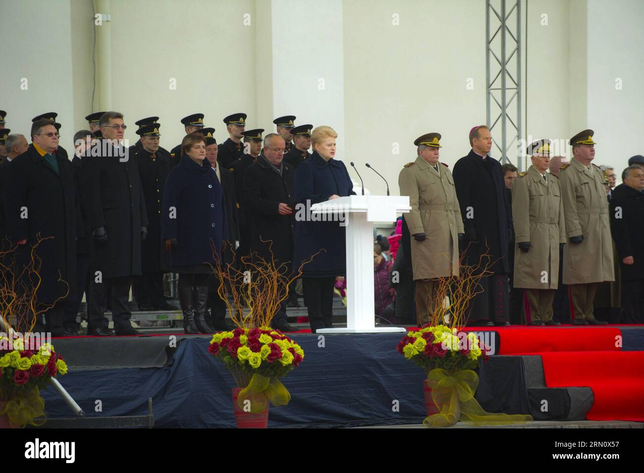 (141123) -- VILNIUS, Nov. 23, 2014 -- Lithuanian president Dalia Grybauskaite (C) addresses the audiences on the celebration in Vilnius, Lithuania, on Nov. 23, 2014. Lithuanian armed forces and troops of some NATO member countries held a gala with formation on Sunday to celebrate the Armed Forces Day. Lithuania s first decree on establishing armed forces was approved on Nov. 23, 1918, which became the Armed Forces Day of the Baltic country. )(bxq) LITHUANIA-VILNIUS-ARMED FORCES DAY AlfredasxPliadis PUBLICATIONxNOTxINxCHN   Vilnius Nov 23 2014 Lithuanian President Dalia Grybauskaite C addresses Stock Photo
