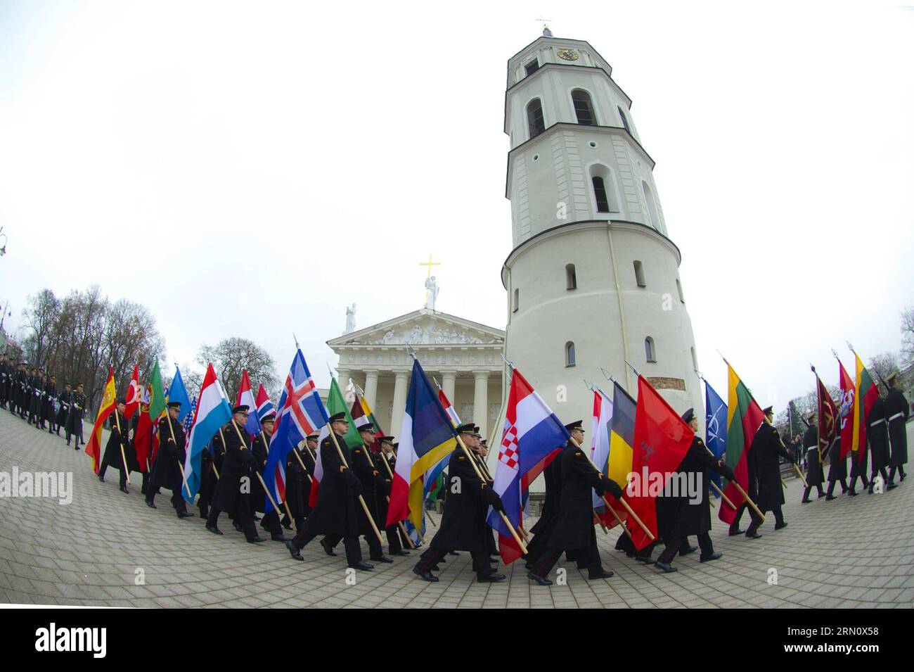 (141123) -- VILNIUS, Nov. 23, 2014 -- Guard of honor carry the flags of NATO member countries on the celebration in Vilnius, Lithuania, on Nov. 23, 2014. Lithuanian armed forces and troops of some NATO member countries held a gala with formation on Sunday to celebrate the Armed Forces Day. Lithuania s first decree on establishing armed forces was approved on Nov. 23, 1918, which became the Armed Forces Day of the Baltic country. )(bxq) LITHUANIA-VILNIUS-ARMED FORCES DAY AlfredasxPliadis PUBLICATIONxNOTxINxCHN   Vilnius Nov 23 2014 Guard of HONOR Carry The Flags of NATO member Countries ON The Stock Photo