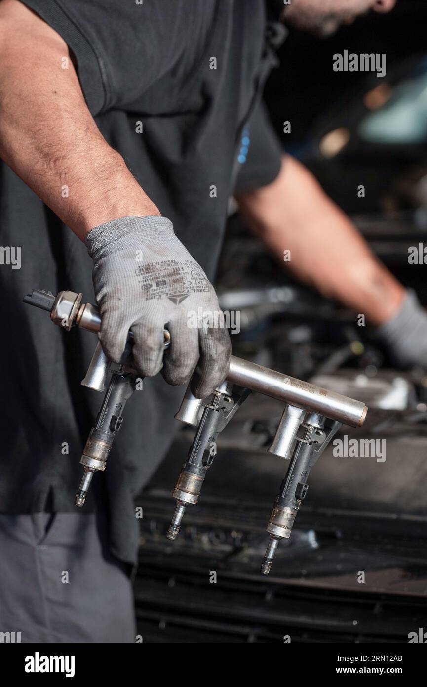 Mechanic working in a garage Stock Photo