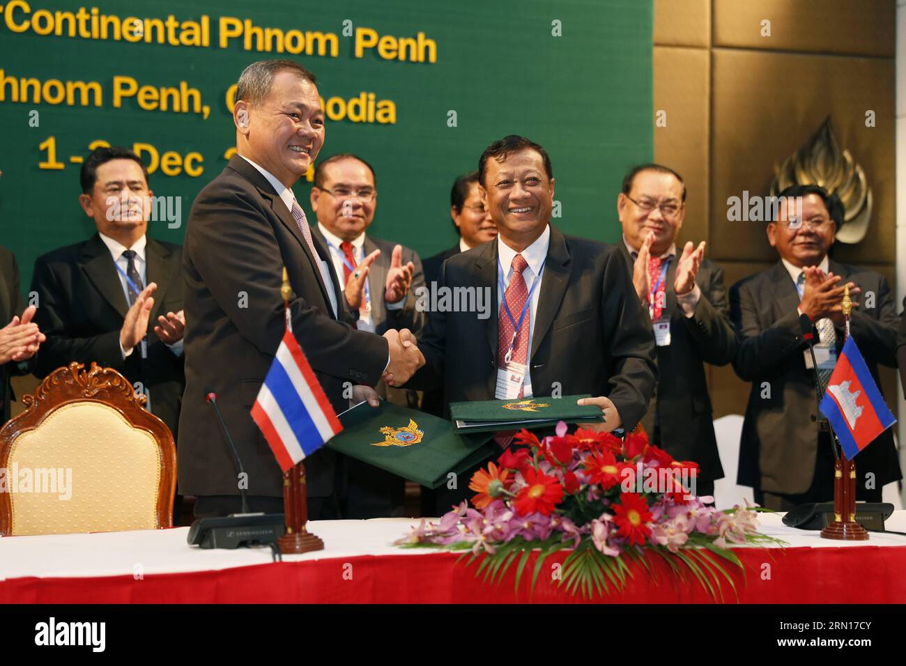 (141203) -- PHNOM PENH, Dec. 3, 2014 -- Secretary of State of Cambodia s defense ministry, Gen. Neang Phat (R front) shakes hands with Lt. Gen. Boonchu Kird-chok, director of the Royal Thai Armed Forces Headquarters border committee, during the signing ceremony in Phnom Penh, Cambodia, Dec. 3, 2014. Cambodian and Thai defense officials on Wednesday vowed to further enhance cooperation along the border for mutual benefits, according to a joint statement released after a two-day meeting. )(azp) CAMBODIA-PHNOM PENH-COOPERATION-DEFENCE Phearum PUBLICATIONxNOTxINxCHN   Phnom Penh DEC 3 2014 Secreta Stock Photo