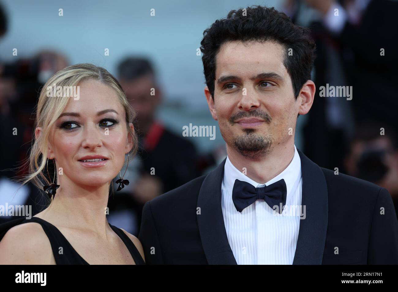 Olivia Hamilton and Damien Chazelle attend the opening red carpet at the 80th Venice International Film Festival on August 30, 2023 in Venice, Italy. Stock Photo