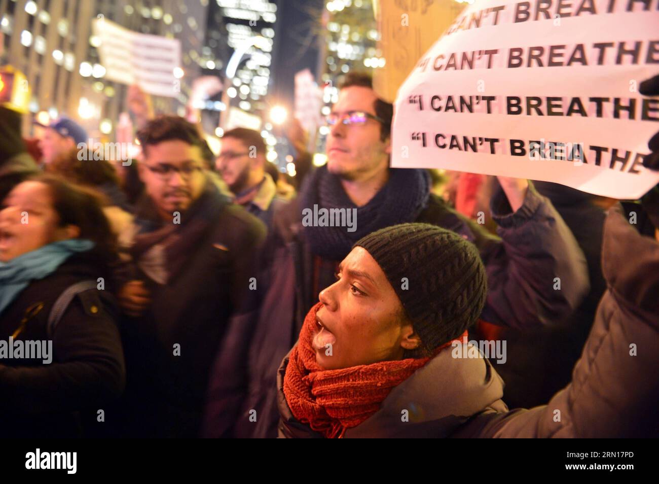 NEW YORK, Dec. 3, 2014 -- Protesters rally at midtown Manhattan in New York, the United States, on Dec. 3, 2014, after a grand jury voted not to indict a white police officer in the chokehold death of a black man on Staten Island. Eric Garner, a 43-year-old father of six, died in July 17 after police officers attempted to arrest him for allegedly selling loose, untaxed cigarettes on Staten Island, New York. azp US-NEW YORK-MIDTOWN MANHATTAN-PROTEST wangxlei PUBLICATIONxNOTxINxCHN Stock Photo