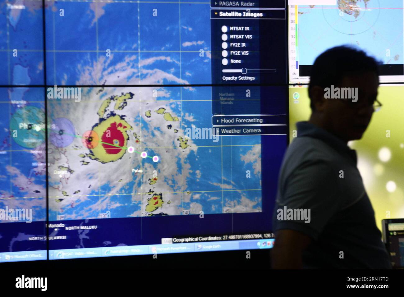 (141204) -- QUEZON CITY, Dec. 4, 2014 -- A meteorologist monitors the path of typhoon Hagupit at the Philippine Atmospheric, Geophysical and Astronomical Services Administration (PAGASA) headquarters in Quezon City, the Philippines, on Dec. 4, 2014. Typhoon Hagupit is packing maximum winds of 205 kph near the center and gustiness of up to 240 kph. The Philippine government will implement forced evacuation in areas that are expected to be hit by typhoon Hagupit (local name Ruby ), a senior government official said Thursday. ) PHILIPPINES-QUEZON CITY-TYPHOON-HAGUPIT RouellexUmali PUBLICATIONxNOT Stock Photo