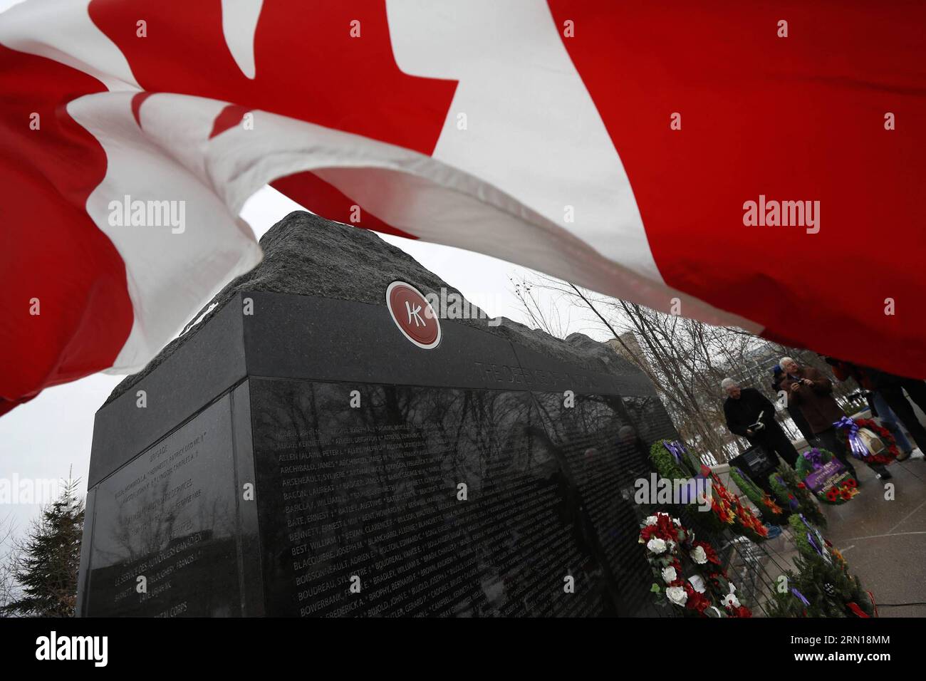 (141206) -- OTTAWA, Dec. 6, 2014 -- People participate in a ceremony to commemorate Canadian soldiers who fought in defense of Hong Kong, China, against the Japanese during WWII at Canadian Force Memorial Wall in Ottawa, Canada, on Dec. 6, 2014. In 1941, about 1,975 Canadian soldiers fought in Hong Kong for 18 days against Japanese troops who outnumbered them. About 290 of them were killed in the battle. ) CANADA-OTTAWA-HONG KONG BATTLE-COMMEMORATION DavidxKawai PUBLICATIONxNOTxINxCHN   Ottawa DEC 6 2014 Celebrities participate in a Ceremony to commemorate Canadian Soldiers Who fought in Defen Stock Photo