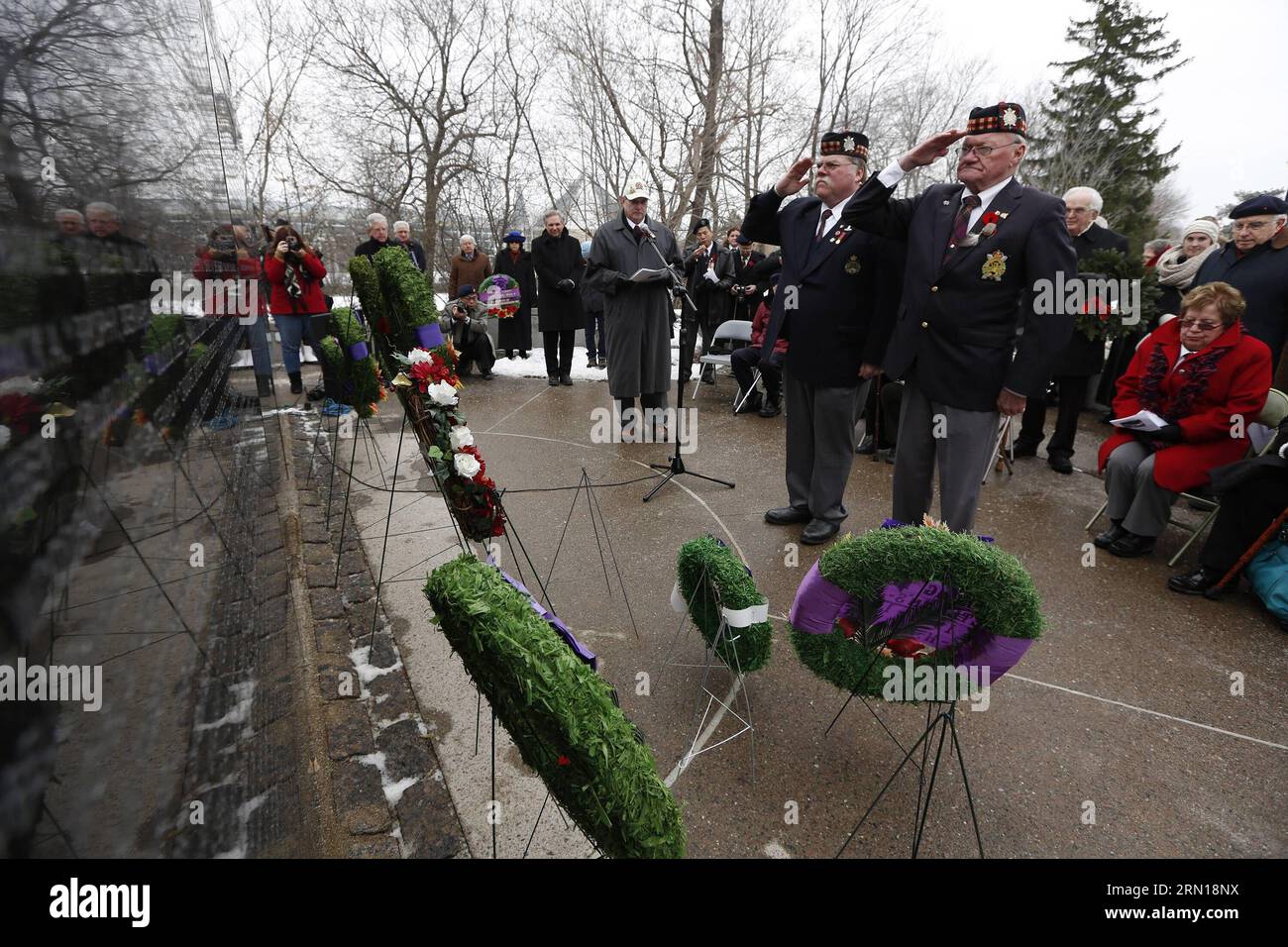 (141206) -- OTTAWA, Dec. 6, 2014 -- People participate in a ceremony to commemorate Canadian soldiers who fought in defense of Hong Kong, China, against the Japanese during WWII at Canadian Force Memorial Wall in Ottawa, Canada, on Dec. 6, 2014. In 1941, about 1,975 Canadian soldiers fought in Hong Kong for 18 days against Japanese troops who outnumbered them. About 290 of them were killed in the battle. ) CANADA-OTTAWA-HONG KONG BATTLE-COMMEMORATION DavidxKawai PUBLICATIONxNOTxINxCHN   Ottawa DEC 6 2014 Celebrities participate in a Ceremony to commemorate Canadian Soldiers Who fought in Defen Stock Photo