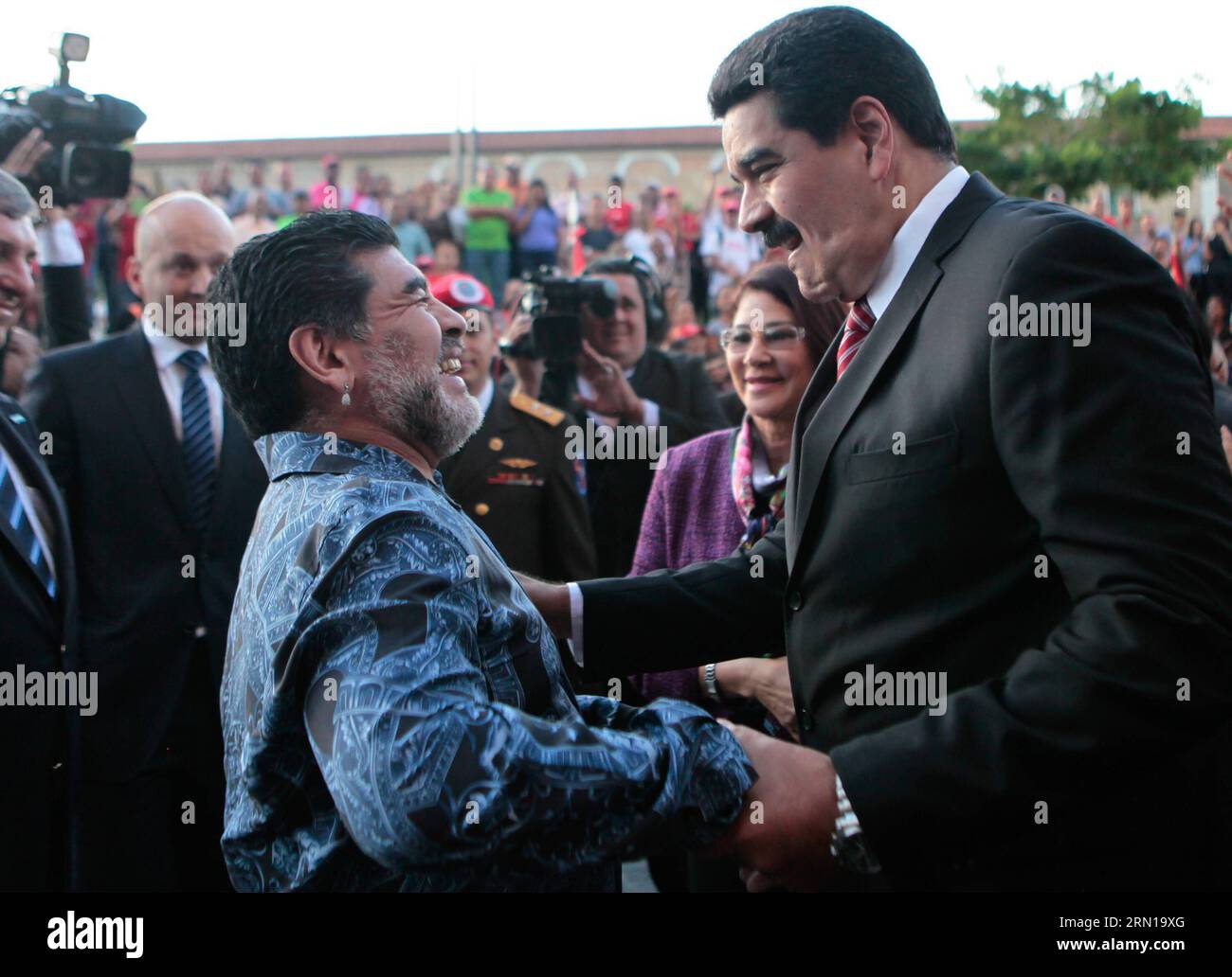 CARACAS, Dec. 9, 2014 -- Image provided by shows Venezuelan President Nicolas Maduro R greeting former Argentine soccer Player Diego Armando Maradona during a ceremony marking the 190th anniversary of the Battle of Ayacucho, at the National Pantheon in Caracas, Venezuela, on Dec. 9, 2014.  SPVENEZUELA-CARACAS-POLITICS-MADURO VENEZUELA SxPRESIDENCY PUBLICATIONxNOTxINxCHN Stock Photo