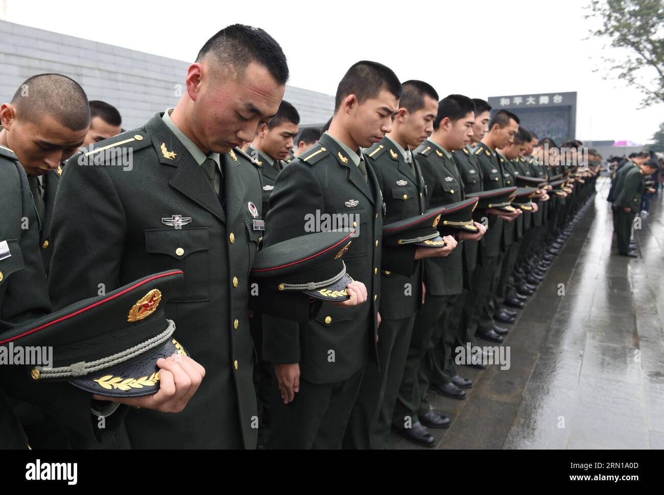 (141210) -- NANJING, Dec. 10, 2014 -- Soldiers of the People s Liberation Army (PLA) mourn during a memorial ceremony at the Memorial Hall of the Victims in Nanjing Massacre by Japanese Invaders, in Nanjing, Dec. 10, 2014.) (mp) CHINA-NANJING-MASSACRE-MEMORIAL CEREMONY(CN) SunxCan PUBLICATIONxNOTxINxCHN   Nanjing DEC 10 2014 Soldiers of The Celebrities S Liberation Army PLA Morne during a Memorial Ceremony AT The Memorial Hall of The Victims in Nanjing Massacre by Japanese Invaders in Nanjing DEC 10 2014 MP China Nanjing Massacre Memorial Ceremony CN  PUBLICATIONxNOTxINxCHN Stock Photo