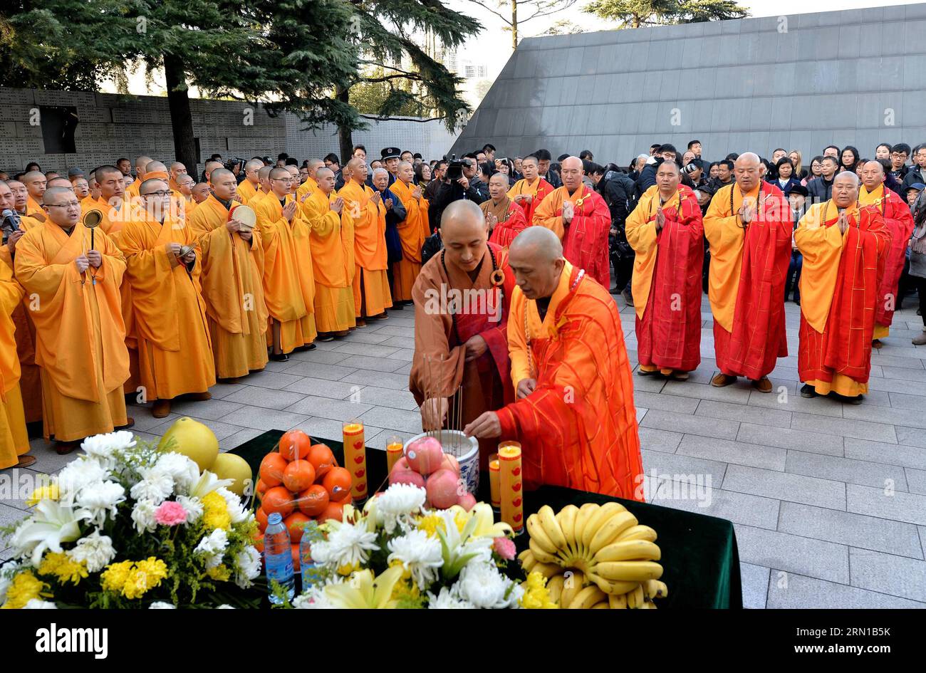 Monks from China, Japan and South Korea pray for the victims of Nanjing Massacre during China s first National Memorial Day for Nanjing Massacre Victims in Nanjing, east China s Jiangsu Province, Dec. 13, 2014. In February 2014, China s top legislature designated Dec. 13 as the National Memorial Day for Nanjing Massacre Victims to mourn those killed by Japanese invaders and expose war crimes committed by the Japanese. ) (zkr) CHINA-NANJING MASSACRE VICTIMS-NATIONAL MEMORIAL DAY(CN) ShenxPeng PUBLICATIONxNOTxINxCHN   Monks from China Japan and South Korea Pray for The Victims of Nanjing Massacr Stock Photo