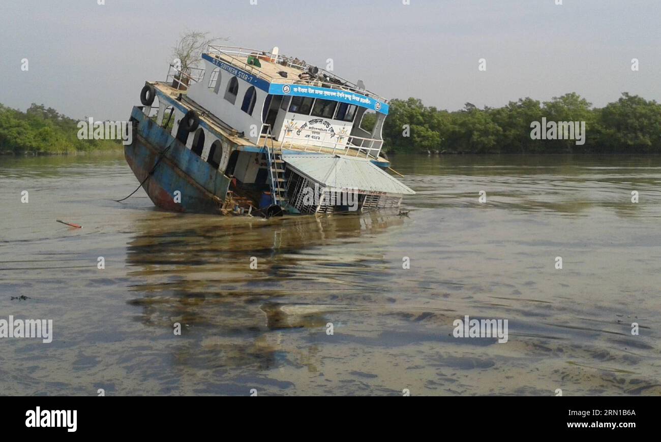 (141213) -- DHAKA, Dec. 13, 2014 () -- Photo taken on Dec. 9, 2014 shows the sinking site on the Shela River in Bangladesh. A 50-km oil slick coated the Shela River flowing through the Bangladeshi part of the world s largest mangrove forest on Thursday after a fuel-laden barge sank two days ago following collision with a heavy tanker. Officials said the authorities have already been working to remove the layer of oil that seeped in the world s largest mangrove forest -- Sundarbans. () BANGLADESH-MASSIVE SPILL-MANGROVE FOREST Xinhua PUBLICATIONxNOTxINxCHN   Dhaka DEC 13 2014 Photo Taken ON DEC Stock Photo