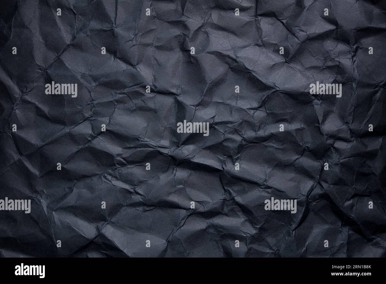 a black sheet of crumpled paper texture Stock Photo