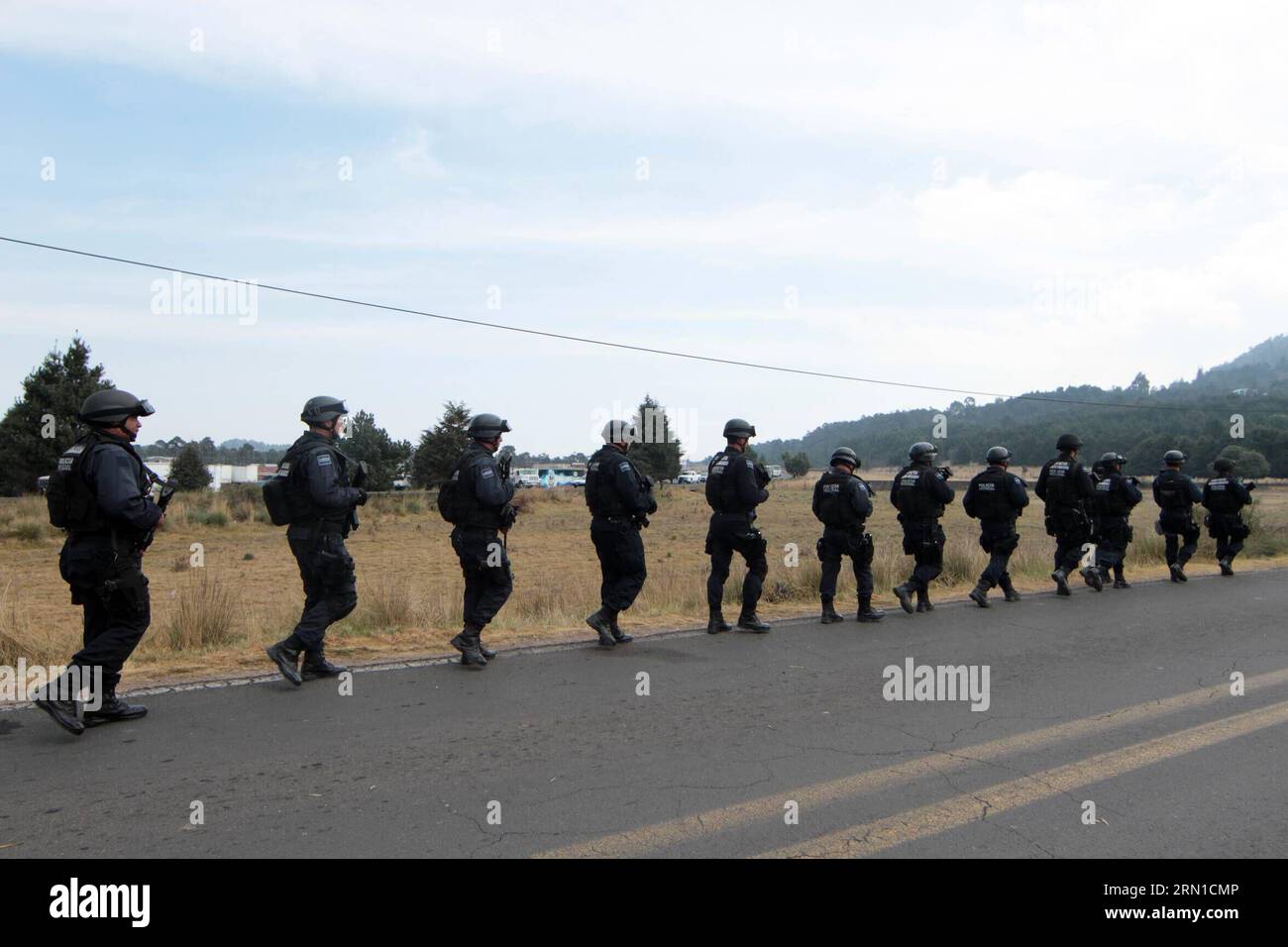 MEXICO CITY, Dec. 17, 2014 -- Forces of security take part in the presentation of the security operation in the forest of Ajusco, addressed by the Mayor of Mexico City Miguel Angel Mancera, in Mexico City, capital of Mexico, on Dec. 17, 2014. Miguel Angel Mancera and National Security Commisioner Monte Alejandro Rubido launched the operation, which also was attended by Attorney of Justice of the Federal District Rodolfo Rios and Secretary of Public Security of Federal District Hiram Almeida. according to local press. Javier Lira/NOTIMEX) (lyi) MEXICO-MEXICO CITY-SECURITY-OPERATIVE e NOTIMEX PU Stock Photo