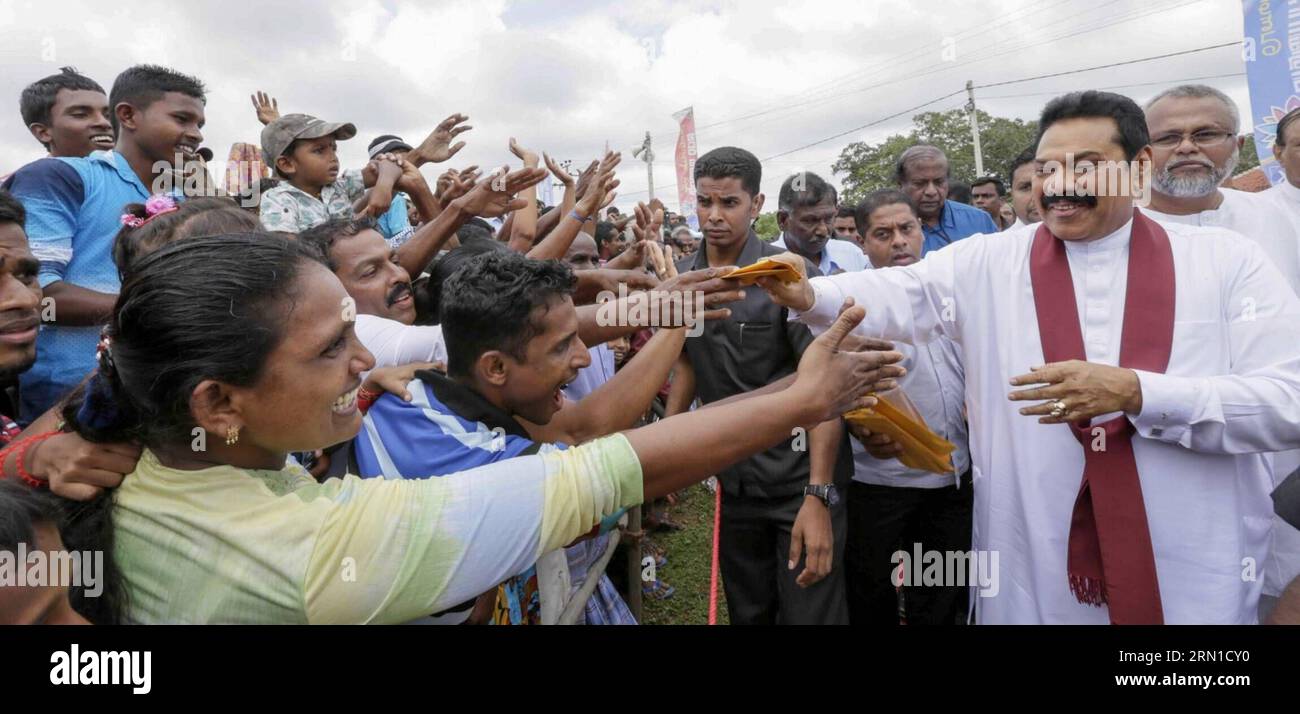 (141218) -- COLOMBO, Dec. 18, 2014 -- Sri Lankan President Mahinda Rajapaksa (front R) greets his supporters during an election rally in Mullaitivu, northern Sri Lanka, on Dec. 18, 2014. Sri Lankan President Mahinda Rajapaksa on Thursday held election rallies in former rebel held northern areas and sought the support of minority Tamils for his bid for a third term in office. ) SRI LANKA-MULLAITIVU-MAHINDA RAJAPAKSA-ELECTION RALLY EaswaranxRutnam PUBLICATIONxNOTxINxCHN   Colombo DEC 18 2014 Sri Lankan President Mahinda Rajapaksa Front r greets His Supporters during to ELECTION Rally in  Norther Stock Photo