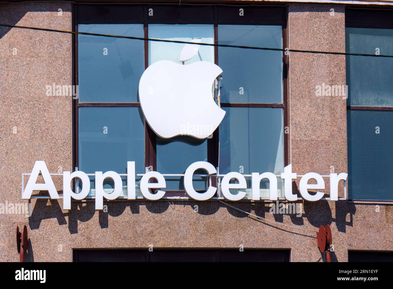 Tyumen, Russia-August 09, 2023: APPLE center and logo. Apple Inc. is an American multinational technology company headquartered in California,United S Stock Photo