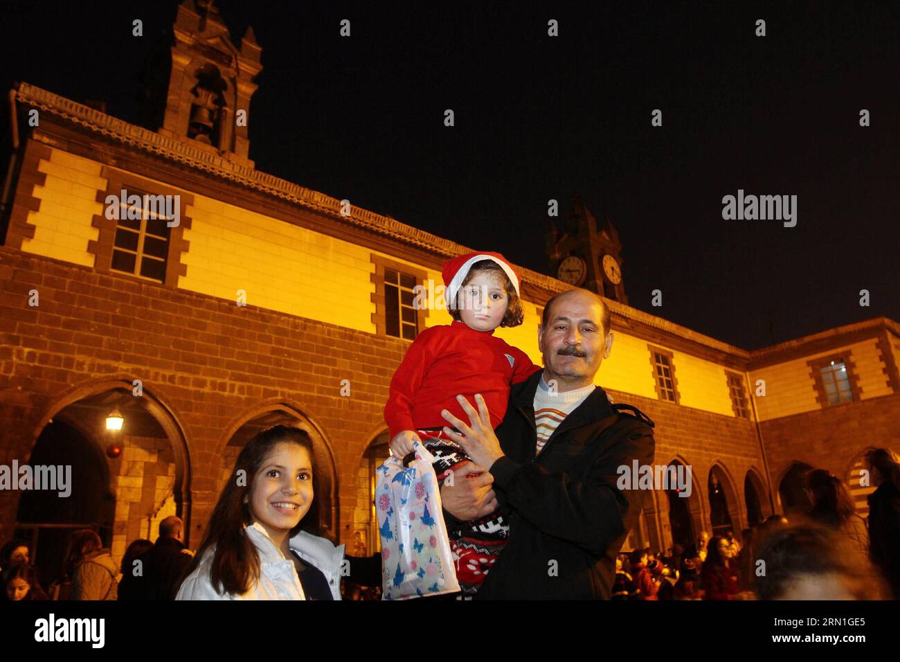 (141230) -- DAMASCUS, Dec. 30, 2014 -- People attend the Christmas celebration at al-Zaitoun Cathedral in Damascus, capital of Syria, on Dec. 30, 2014. About 1,500 Syrian Christian kids and their parents gathered at al-Zaitoun Cathedral in Syria s capital Damascus to take part in a Christmas celebration. About 10 percent of population in Syria are Christian, who suffered persecution in some parts of the country by the hands of the extremist groups. )(zhf) SYRIA-DAMASCUS-CHRISTIAN-CHRISTMAS CELEBRATION bassemxtellawi PUBLICATIONxNOTxINxCHN   Damascus DEC 30 2014 Celebrities attend The Christmas Stock Photo