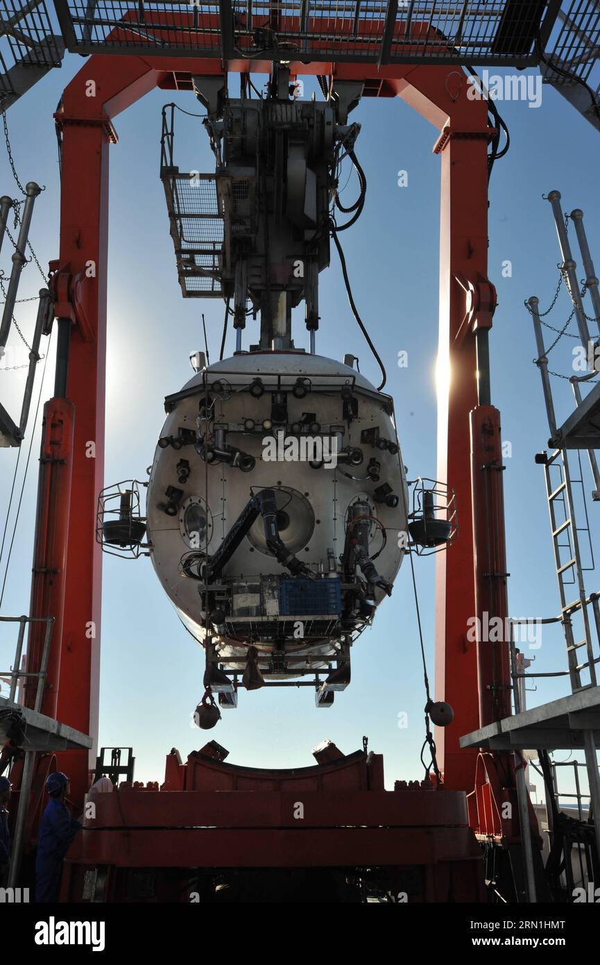 ABOARD XIANGYANGHONG 09, Jan. 2, 2015 -- Photo taken on Jan. 2, 2015 shows China s deep sea manned submersible Jiaolong on its carrier Xiangyanghong 09 in the Indian Ocean. Jiaolong carried out the first dive on a mission to study active hydrothermal vent in the southwestern Indian Ocean on Jan. 2. It was the first time for the submersible to take the second batch of pilot trainees in the diving, which was intended to enable the trainees to learn some skills of submersible operation in active hydrothermal vent and collect samples of hydrothermal fluid, sulfide, rocks, sediment and water. ) (hd Stock Photo