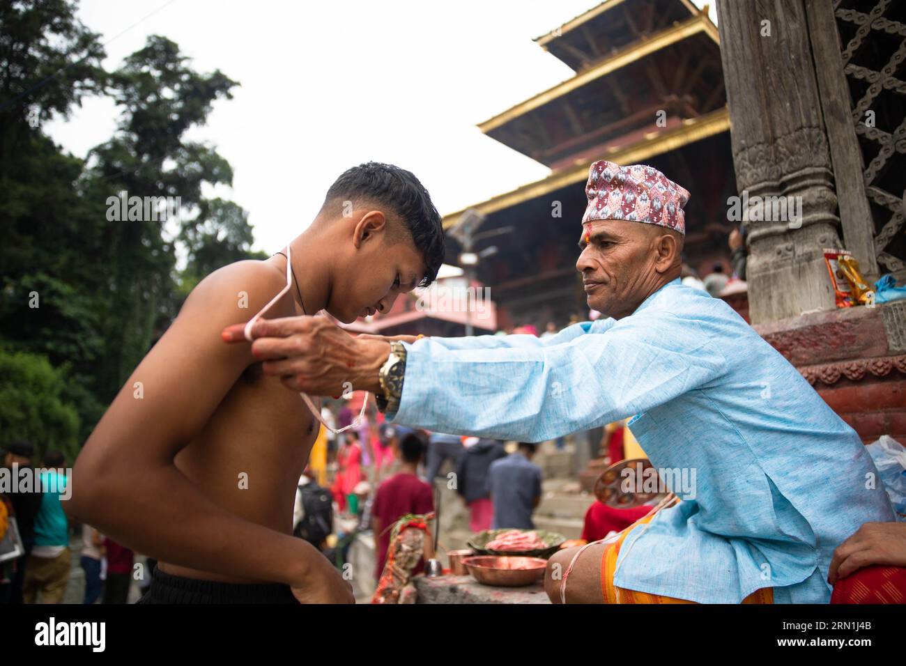 Kathmandu Nepal 31st Aug 2023 A Nepalese Devotee Receives A Janai kathmandu-nepal-31st-aug-2023-a-nepalese-devotee-receives-a-janai