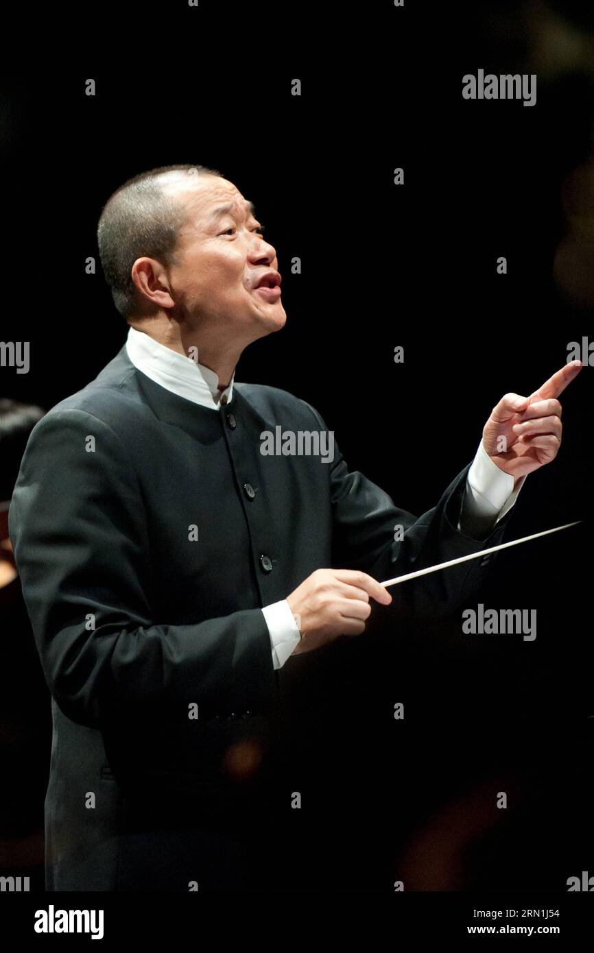 SANTIAGO, Jan. 4, 2015 -- Chinese composer Tan Dun directs the concert Trilogy of Martial Arts at the 22nd International Festival Santiago a Mil in Santiago, capital of Chile, on Jan. 4, 2015. The concert Trilogy of Martial Arts is composed of songs that belong to the original soundtracks of the movies Hero of Zhang Yimou, Crouching Tiger, Hidden Dragon of Ang Lee, and The Banquet of Feng Xiaogang. The 16-day festival was opened on Jan. 3 to stage over 90 shows. ) (da) CHILE-CHINA-CULTURE-TAN DUN JORGExVILLEGAS PUBLICATIONxNOTxINxCHN   Santiago Jan 4 2015 Chinese Composer TAN Dun Direct The Co Stock Photo