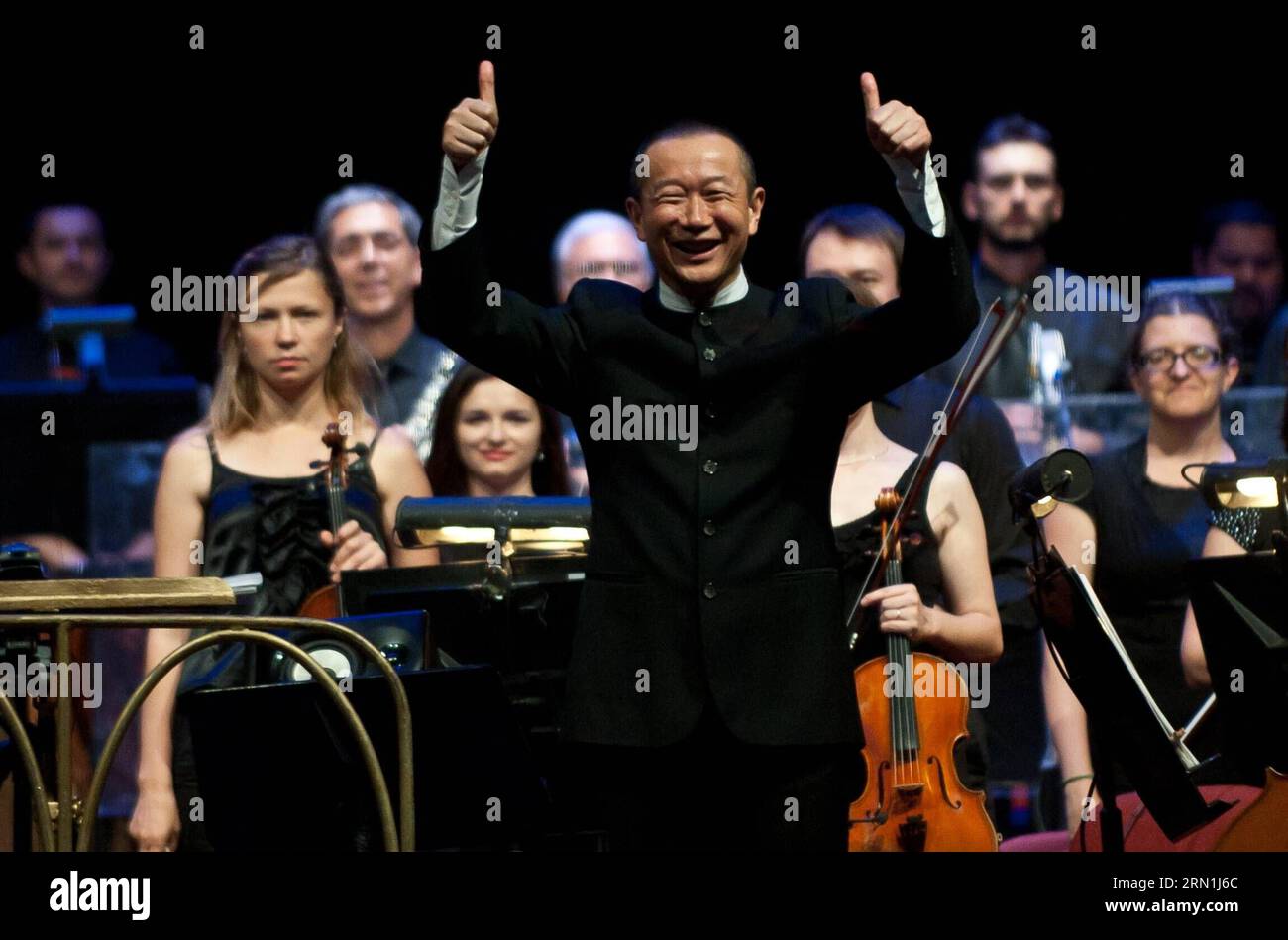 SANTIAGO, Jan. 4, 2015 -- Chinese composer Tan Dun gestures after directing the concert Trilogy of Martial Arts at the 22nd International Festival Santiago a Mil in Santiago, capital of Chile, on Jan. 4, 2015. The concert Trilogy of Martial Arts is composed of songs that belong to the original soundtracks of the movies Hero of Zhang Yimou, Crouching Tiger, Hidden Dragon of Ang Lee, and The Banquet of Feng Xiaogang. The 16-day festival was opened on Jan. 3 to stage over 90 shows. ) (da) CHILE-CHINA-CULTURE-TAN DUN JORGExVILLEGAS PUBLICATIONxNOTxINxCHN   Santiago Jan 4 2015 Chinese Composer TAN Stock Photo