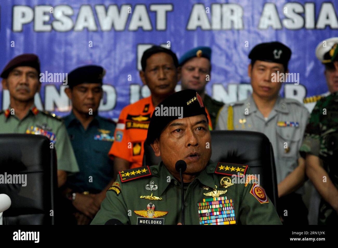 (150106) -- PANGKALAN BUN, Jan. 6, 2015 -- Indonesian Military Commander General Moeldoko (front) speaks during a press conference after joining in the search of Airasia QZ 8501 victims in Pangkalan Bun, Indonesia, Jan. 6, 2015. The search operation for AirAsia Flight QZ8501 will spread slightly eastward on Tuesday as the weather and currents drag wreckage in that direction, the head of Indonesia s rescue agency said. ) INDONESIA-PANGKALAN BUN-AIRASIA-PRESS CONFERENCE AgungxKuncahyaxB. PUBLICATIONxNOTxINxCHN   Pangkalan Bun Jan 6 2015 Indonesian Military Commander General  Front Speaks during Stock Photo
