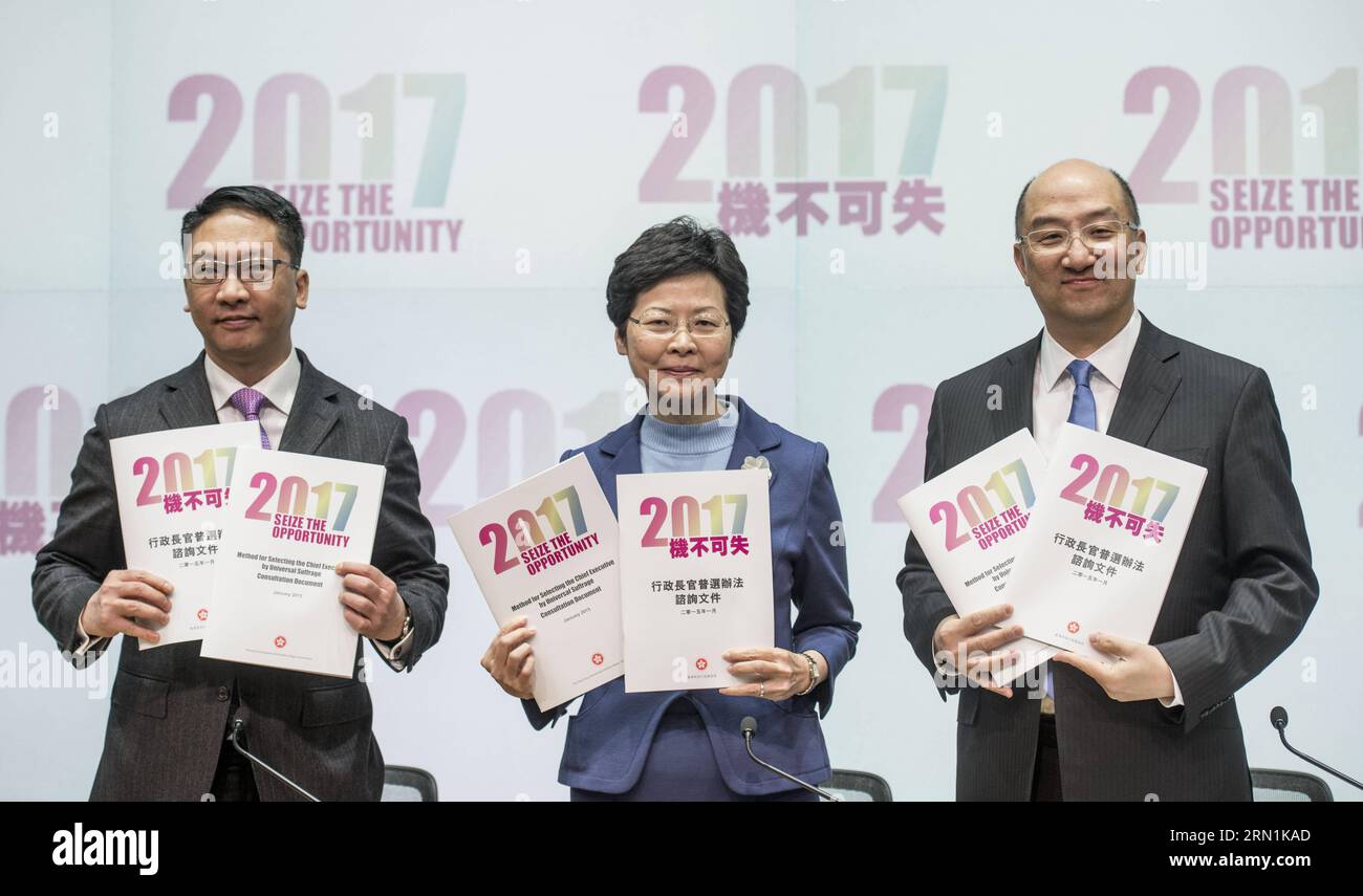 (150107) -- HONG KONG, Jan. 7, 2015 -- Hong Kong Chief Secretary for Administration Carrie Lam (C), Secretary for Justice Rimsky Yuen (L) and Secretary for Constitutional and Mainland Affairs Raymond Tam Chi-yuen attend a press conference in Hong Kong, south China, Jan. 7, 2015. Hong Kong Wednesday announced the launch of the second round of public consultation on constitutional reform in the Legislative Council. ) (wyl) CHINA-HONG KONG-PUBLIC CONSULTATION (CN) LuixSiuxWai PUBLICATIONxNOTxINxCHN   Hong Kong Jan 7 2015 Hong Kong Chief Secretary for Administration Carrie LAM C Secretary for Just Stock Photo