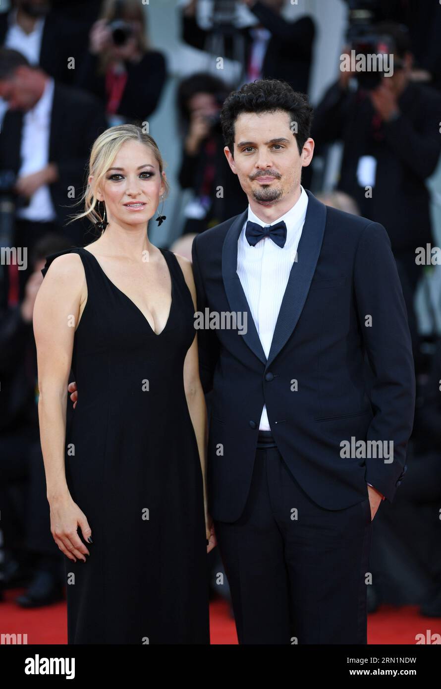 Venice, Italy. 30th Aug, 2023. The jury president Damien Chazelle (R) and actress Olivia Hamilton pose on the red carpet of the 80th Venice International Film Festival in Venice, Italy, Aug. 30, 2023. The 80th annual Venice International Film Festival kicked off here on Wednesday evening, with a diverse line-up of movies competing for the prestigious Golden Lion prize. Credit: Jin Mamengni/Xinhua/Alamy Live News Stock Photo