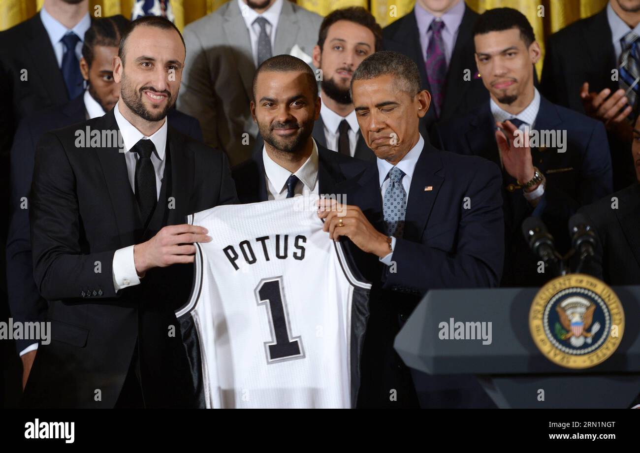 WASHINGTON D.C., Jan. 12, 2015 -- U.S. President Barack Obama (2nd R) reacts as he accepts a San Antonio Spurs jersey from team member Manu Ginobili during an event honoring the 2014 NBA champions the San Antonio Spurs in the East Room of the White House in Washington D.C., the United States, on Jan. 12, 2015. ) (SP)U.S.-WASHINTON D.C.-NBA-OBAMA YinxBogu PUBLICATIONxNOTxINxCHN   Washington D C Jan 12 2015 U S President Barack Obama 2nd r reacts As he accepts a San Antonio Spurs Jersey from Team member Manu  during to Event honoring The 2014 NBA Champions The San Antonio Spurs in The East Room Stock Photo