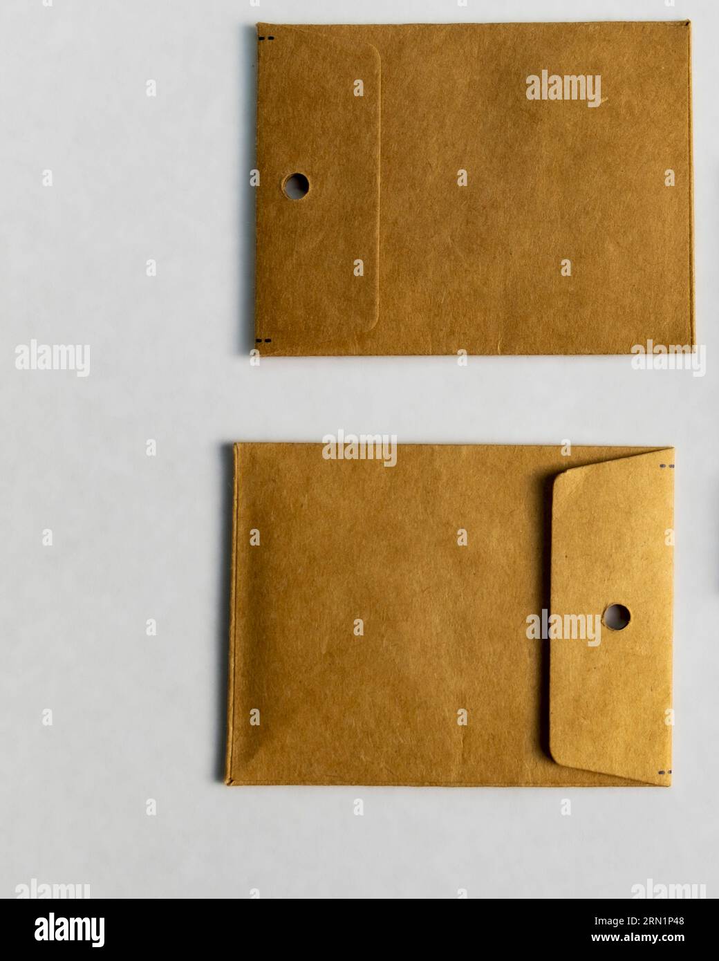 Geometric Placement of Brown Kraft Paper Sleeve Envelopes Stock Photo