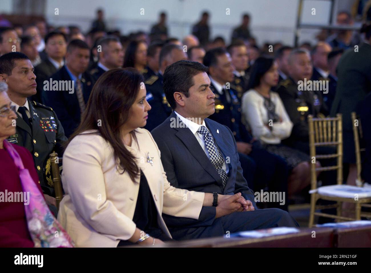 (150130) -- TEGUCIGALPA, Jan. 30, 2015 -- Honduras President Juan Orlando Hernandez (R, front) and his wife Ana Garcia de Hernandez (L, front) attend a religious service commemorating the 268th anniversary of the discovery of the Virgin of Suyapa, which is a six-centimeter tall 18th-century statue of the Virgin Mary, in the Suyapa Basilica, in Tegucigalpa, Honduras, on Jan. 30, 2015. Rafael Ochoa) (da) HONDURAS-TEGUCIGALPA-POLITICS-HERNANDEZ e RAFAELxOCHOA PUBLICATIONxNOTxINxCHN   Tegucigalpa Jan 30 2015 Honduras President Juan Orlando Hernandez r Front and His wife Ana Garcia de Hernandez l F Stock Photo