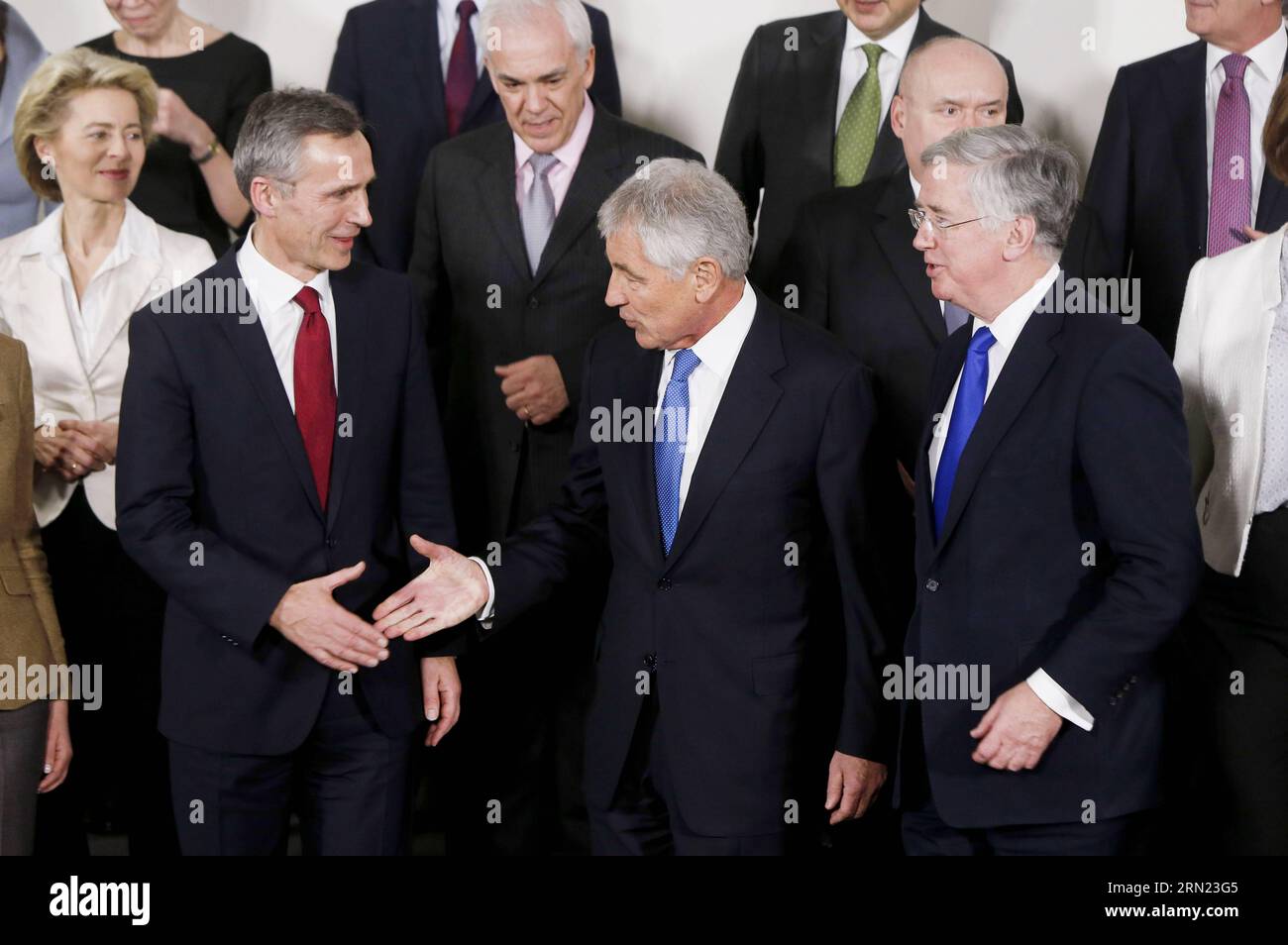 (150205) -- BRUSSELS, Feb. 5, 2015 -- U.S. Defense Secretary Chuck Hagel (C, front) shakes hands with NATO Secretary General Stoltenberg (L, front) as British Defense Secretary Michael Fallon (R, front) looks on while posing for a family photo before the NATO defense ministers meeting at the Alliance headquarters in Brussels, capital of Belgium, Feb. 5, 2014. NATO Defense Ministers gathered here on Thursday to discuss the implementation of the Readiness Action Plan and the Ukraine crisis. Zhou Lei) BELGIUM-NATO-DEFENSE MINISTER-MEETING ?? PUBLICATIONxNOTxINxCHN   Brussels Feb 5 2015 U S Defens Stock Photo