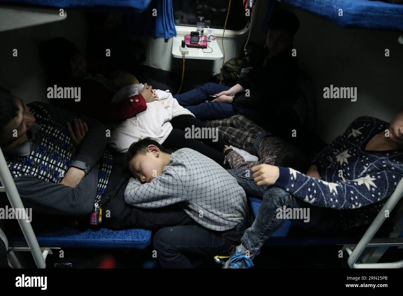 Passengers have a sleep on train 3663, which runs from east China s Shanghai to Chengdu, capital of southwest China s Sichuan Province, on Sept. 9, 2015. The Spring Festival, or the Chinese lunar New Year which starts from Feb. 19 this year, is known as the world s biggest migration, with millions of people traveling vast distances for family reunions. Ding Ting) (lfj) CHINA-SPRING FESTIVAL-HOME RETURNING (CN) PeixXin PUBLICATIONxNOTxINxCHN   Passengers have a Sleep ON Train 3663 Which runs from East China S Shanghai to Chengdu Capital of Southwest China S Sichuan Province ON Sept 9 2015 The S Stock Photo