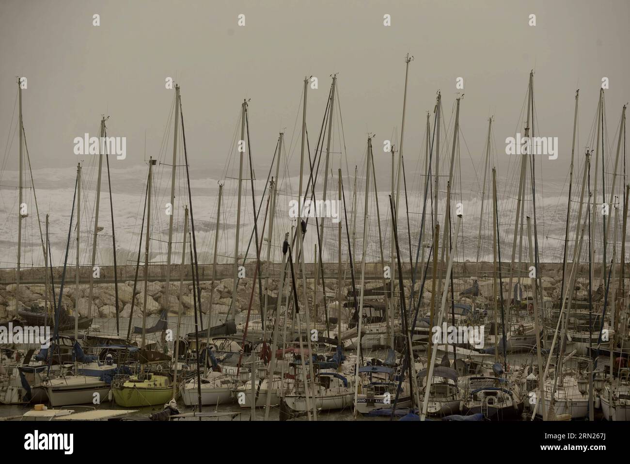 (150212) -- TEL AVIV,  Yachts are anchored due to a sandstorm in Tel Aviv, Israel, on Feb. 11, 2015. A sandstorm continues to blow hard in parts of the Middle East on Wednesday, where authorities have remained sea ports closed and briefly grounded flights. Israel has been hit by the developing sandstorm. The country temporarily shut down two airports and suspended all domestic flights Wednesday morning as the sandstorm hit the country, the Israel Airport Authority said in a statement. ) ISRAEL-TEL AVIV-STORM JINI/TomerxNeubeg PUBLICATIONxNOTxINxCHN   Tel Aviv Yachts are anchored Due to a sands Stock Photo
