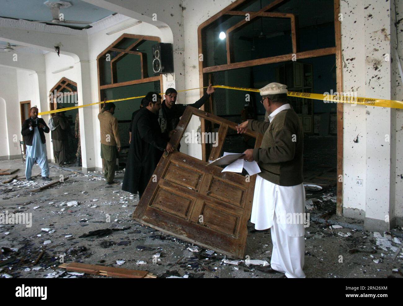(150213) -- PESHAWAR, Feb. 13, 2015 -- Pakistani security officials inspect the suicide blast site in northwest Pakistan s Peshawar on Feb. 13, 2015. At least 19 people were killed and over 40 others injured in a twin suicide attack at a mosque of Shia Muslims in Pakistan s northwestern provincial capital of Peshawar Friday afternoon, officials said. )(bxq) PAKISTAN-PESHAWAR-SUICIDE-BLAST AhmadxSidique PUBLICATIONxNOTxINxCHN   Peshawar Feb 13 2015 Pakistani Security Officials inspect The Suicide Blast Site in Northwest Pakistan S Peshawar ON Feb 13 2015 AT least 19 Celebrities Were KILLED and Stock Photo