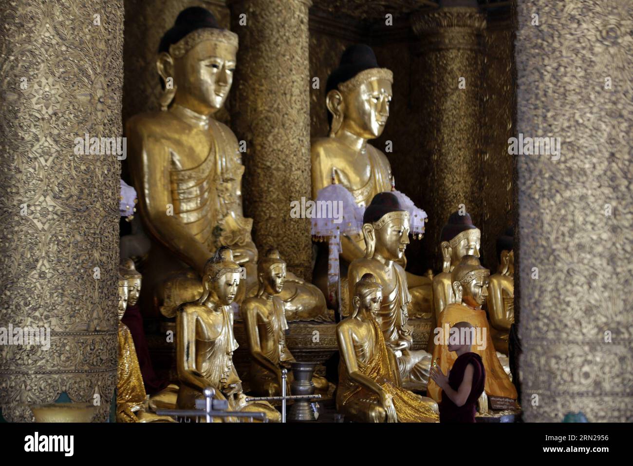 YANGON, Feb. 17, 2015 -- A Buddhist novice pays homage at the Shwedagon pagoda in Yangon, Myanmar, Feb. 17, 2015. Shwedagon Pagoda is a repository of the best of Myanmar s heritages -- architecture, sculpture and arts. It consists of hundreds of colorful temples, stupas and statues that reflect architectural styles spanning almost 2,500 years. ) MYANMAR-YANGON-SHWEDAGON PAGODA UxAung PUBLICATIONxNOTxINxCHN   Yangon Feb 17 2015 a Buddhist novice Pays Homage AT The Shwedagon Pagoda in Yangon Myanmar Feb 17 2015 Shwedagon Pagoda IS a repository of The Best of Myanmar S heritage Architecture Sculp Stock Photo
