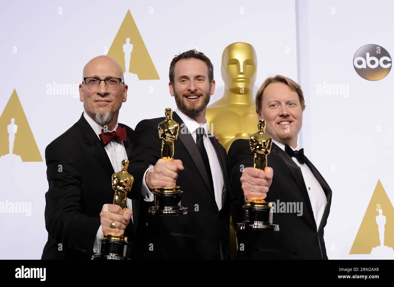 (150223) -- LOS ANGELES, Feb. 22, 2015 -- Directors Don Hall (R), Chris Williams (C) and Roy Conli pose after winning the Best Animated Feature Film award for Big Hero 6 during the 87th Academy Awards at the Dolby Theater in Los Angeles, the United States, on Feb. 22, 2015. )(bxq) US-LOS ANGELES-OSCARS-BEST ANIMATED FEATURE FILM YangxLei PUBLICATIONxNOTxINxCHN   Los Angeles Feb 22 2015 Directors Don Hall r Chris Williams C and Roy  Pose After Winning The Best Animated Feature Film Award for Big Hero 6 during The 87th Academy Awards AT The Dolby Theatre in Los Angeles The United States ON Feb 2 Stock Photo
