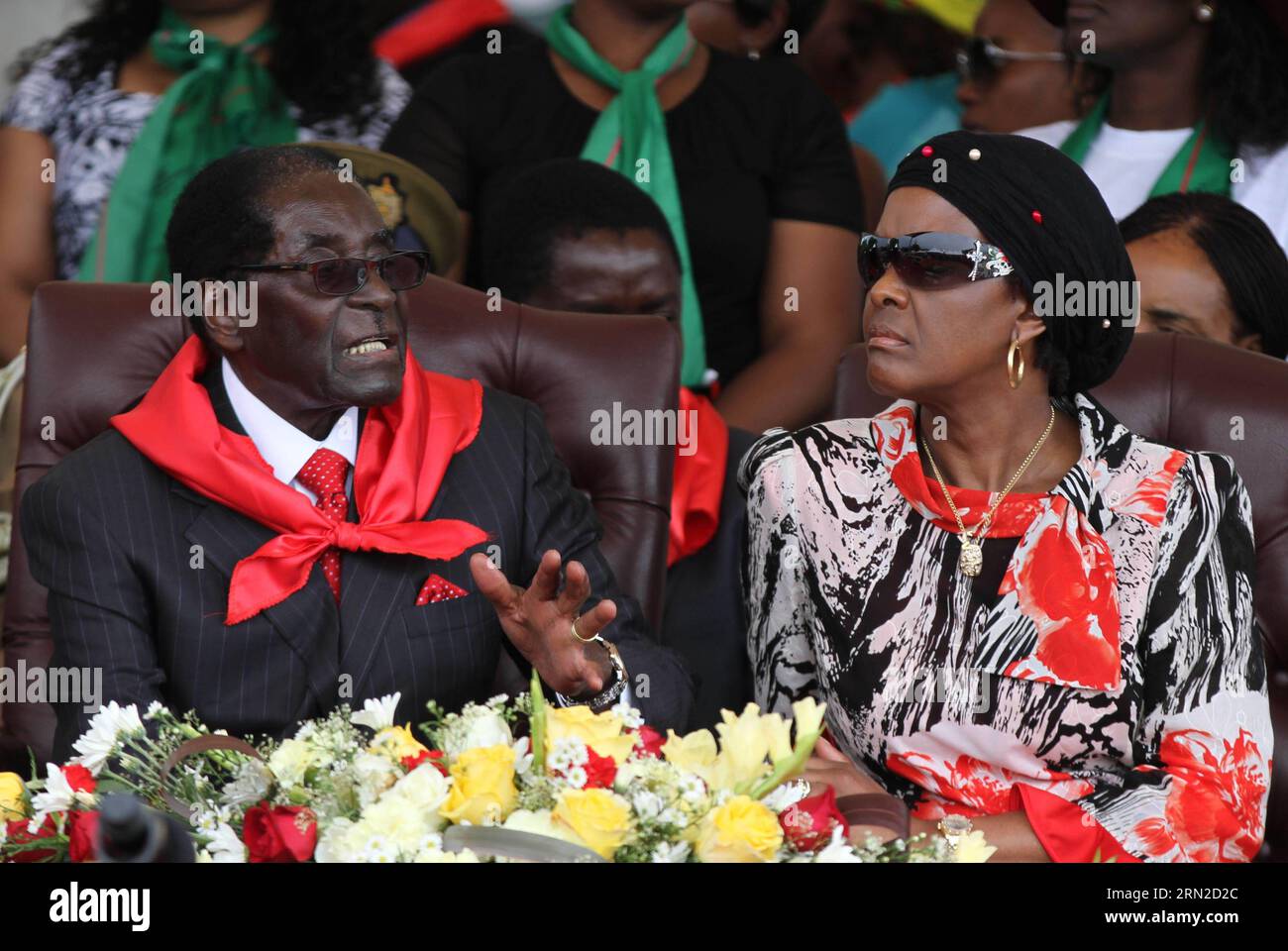 (150228) -- VICTORIA FALLS (ZIMBABWE), Feb. 28, 2015 () -- Zimbabwean President Robert Mugabe (L) and his wife Grace Mugabe chat on the podium at a public celebration held to mark his 91st birthday in Victoria Falls, Zimbabwe, Feb. 28, 2015. Mugabe, who turns 91 this month, is the oldest leader in the world and one of the longest-serving African statesmen. Having ruled Zimbabwe for 35 years since independence, Mugabe was endorsed by the ruling ZANU-PF party as the sole candidate to contest at the age of 94 in the next presidential election in 2018. () ZIMBABWE-VICTORIA FALLS-MUGABE-BIRTHDAY Xi Stock Photo